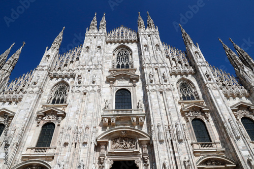 The west facade of the Duomo, the Gothic style cathedral dedicated to St. Mary, Milan, Lombardy, Italy