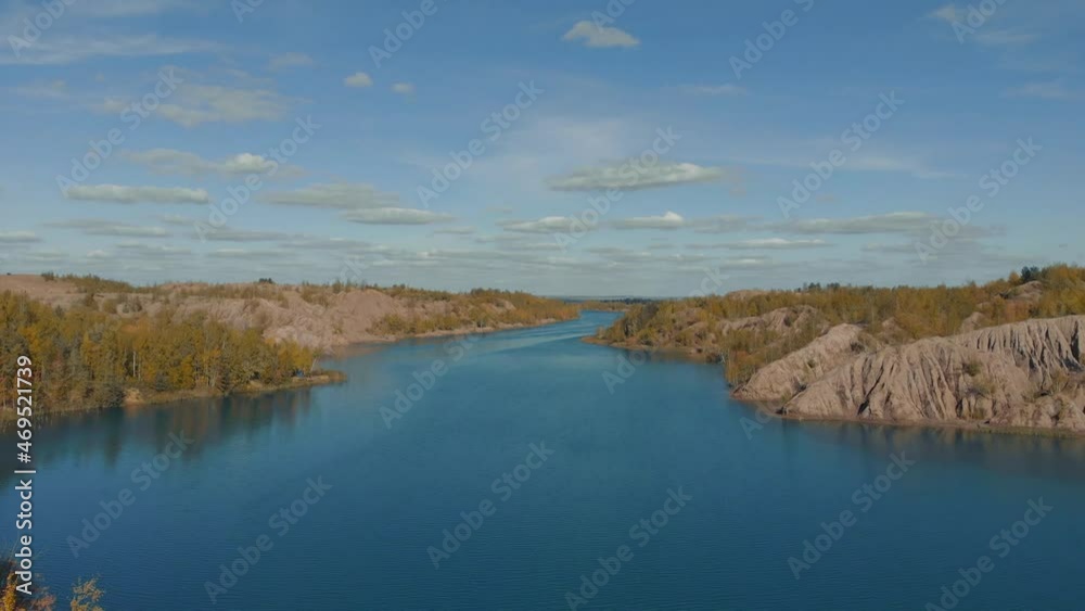 Drone flies over the blue river. Beautiful landscape with a meander river. Flying over a blue lake. Wild nature scene Drone flies over the blue river. Beautiful landscape with a meander river. Flying over a blue lake. Wild nature scene
