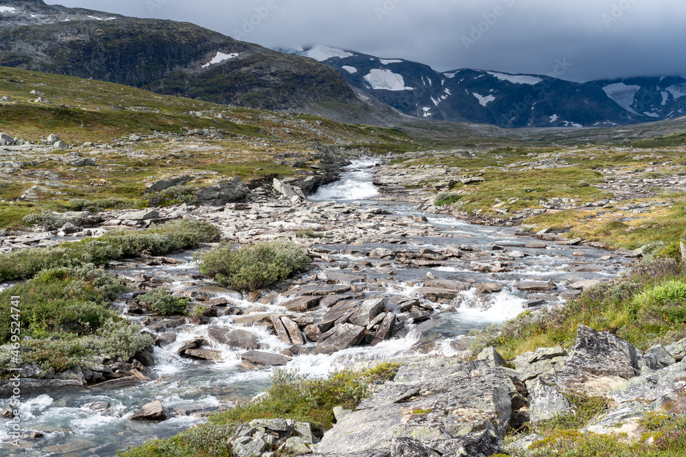 Small stream running through rocky terrain in Norway’s mountainous wilderness.