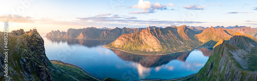 Husfjellet mountain reflected in the blue water of Ersfjord and Steinfjord fjords at sunset, aerial view, Senja, Troms, Norway, Scandinavia photo