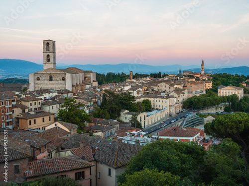 View of Perugia's cityscape from Giardini Carducci viewpoint at sunset, Perugia, Umbria, Italy photo