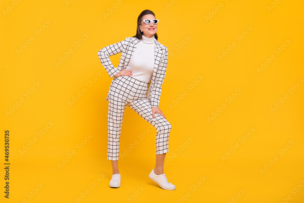 Fototapeta premium Full body photo of satisfied glad person hand on waist posing isolated on bright yellow color background