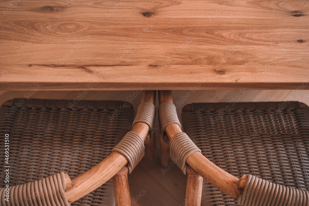 Interior of dining room with wooden table and chairs Interior of dining room with wooden table and chairs
