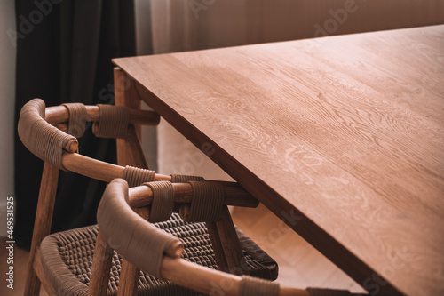 Interior of dining room with wooden table and chairs
