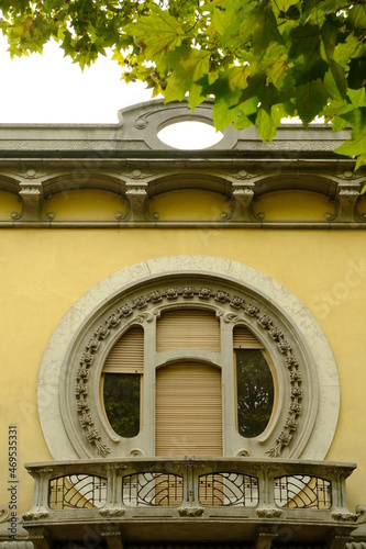 Circular window. Circular window of a secessionist house.Quaroni house in Novara inspired by the principles of the Viennese secession.  photo