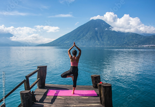 Morning yoga on the dock, San Marcos, Lake Atitlan, Guatemala photo
