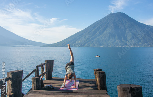 Morning yoga on the dock, San Marcos, Lake Atitlan, Guatemala photo