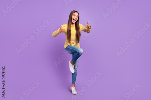 Full size photo of young cheerful lady show thumb-up ads suggest perfect isolated over violet color background