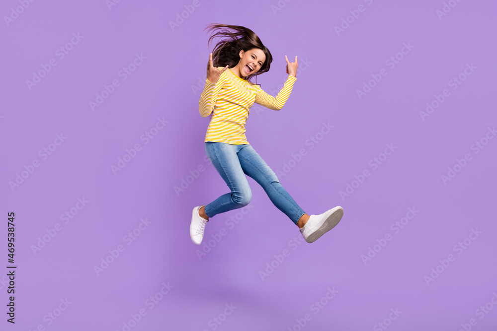 Full body profile side photo of youth excited girl show fingers horns symbol rude isolated over purple color background