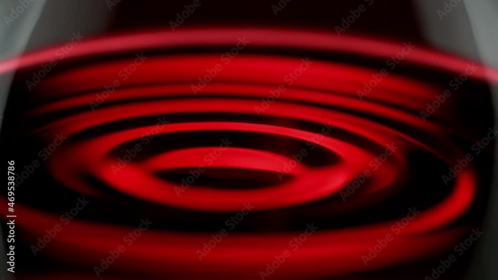 Super slow motion of waving red wine in macro shot. Filmed on high speed cinema camera, 1000 fps