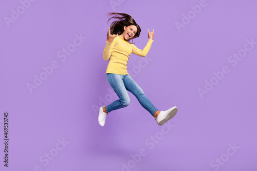 Fototapeta Naklejka Na Ścianę i Meble -  Full body profile side photo of youth excited girl show fingers horns symbol rude isolated over purple color background