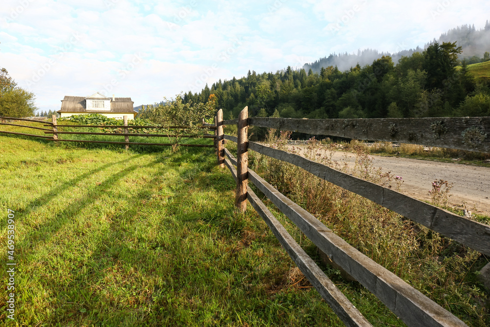 Beautiful view with wooden fence near road