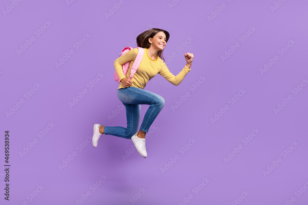 Full size profile side photo of young girl run hurry hold bag college isolated over purple color background