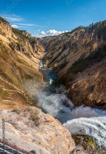 River flowing through the popular Grand Canyon of the Yellowstone, the Lower Falls beneath the feet