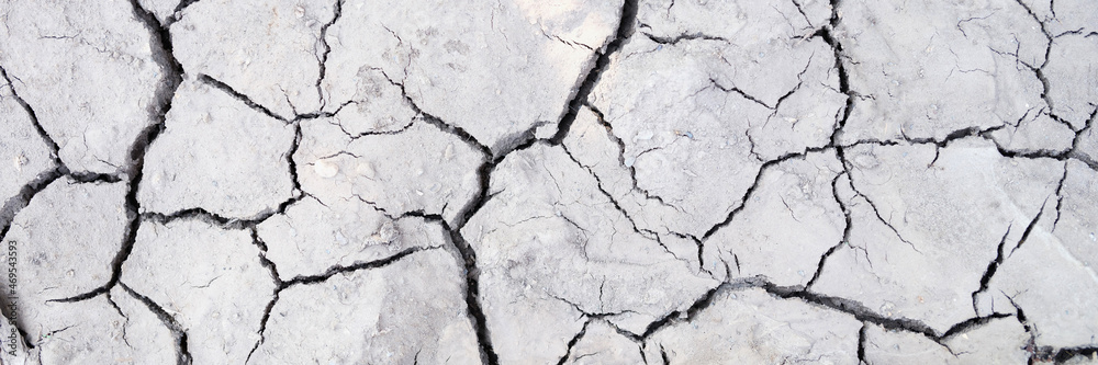 Fototapeta premium Closeup of crack on dry ground background