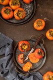 Ripe persimmon on a wooden table