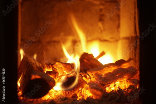 the fire is burning in the fireplace at night 