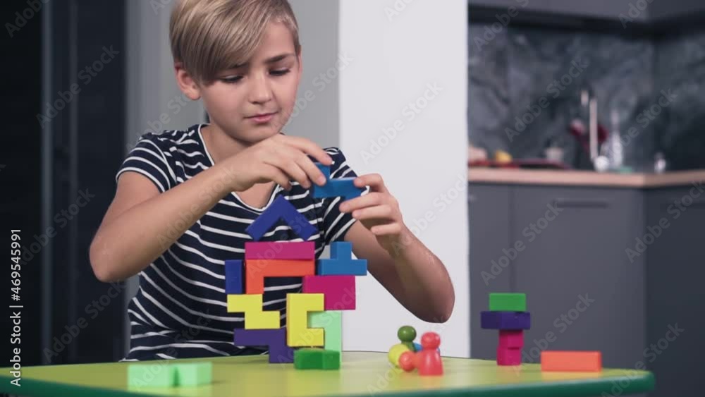 custom made wallpaper toronto digitalYoung boy plays with colourful blocks, slow motion. Schoolboy plays a game, developing logical thinking.