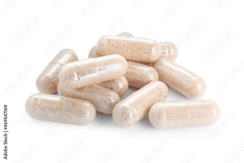 Many transparent gelatin capsules on white background Many transparent gelatin capsules on white background