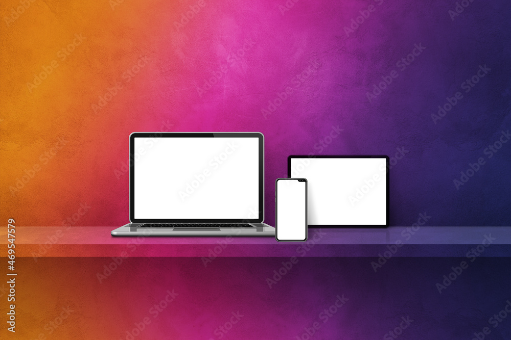 Laptop, mobile phone and digital tablet pc on rainbow wall shelf. Horizontal background