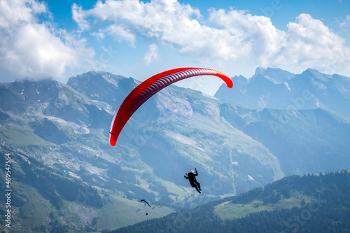 paragliding flight in the mountains. Le Grand-Bornand, France photo
