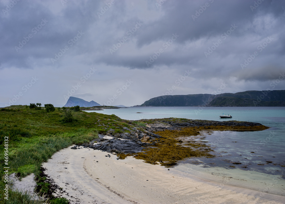 white sand and Cloudy sky in the clear and arctiic beach in Sommarøy