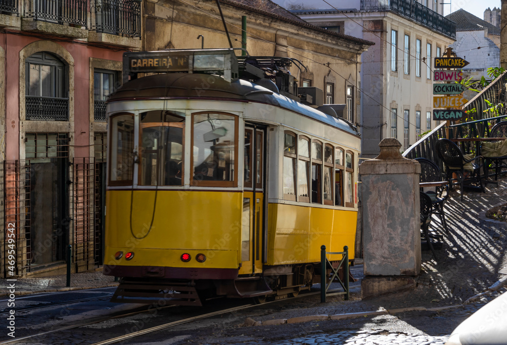 Old tram running down street of Lisbon's old town