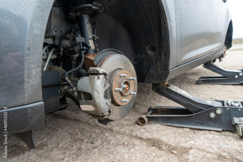 Close-up photograph of a brake disc at a service station. Repair balancing and tire fitting of wheels.