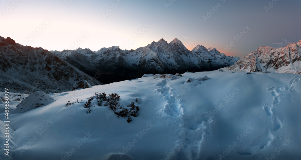 mountain peaks and ridges covered with snow at sunrise in Karachay-Cherkessia