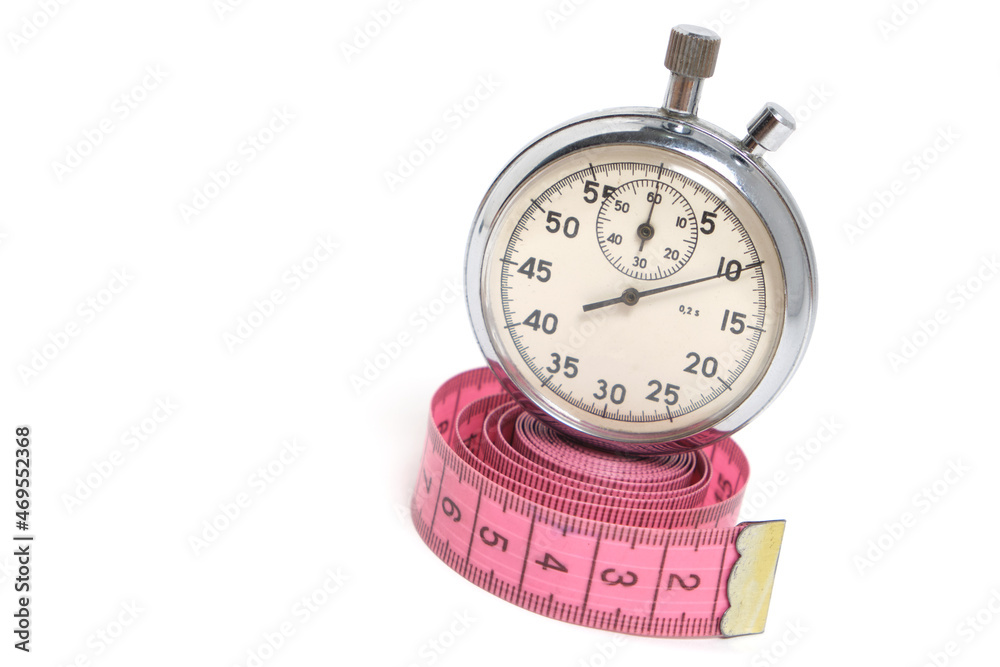 Stopwatch and measuring meter on white background.Sports, health and fitness. Stopwatch and measuring meter on white background.Sports, health and fitness.