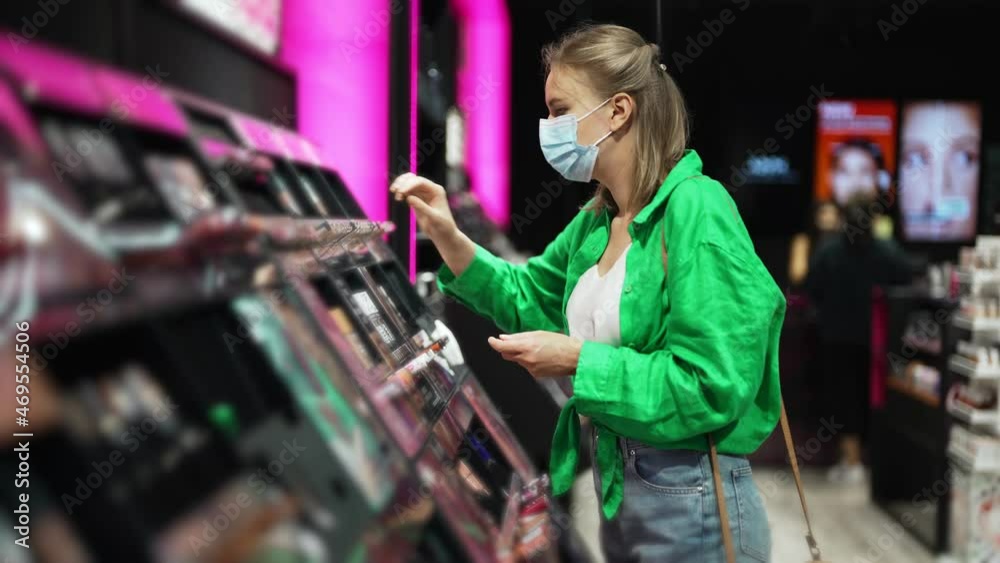 Woman trying cosmetics products in the cosmetics store. Woman trying cosmetics products in the cosmetics store.