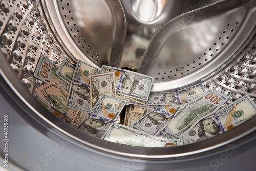 Money in washing machine, closeup view. Money washing and laundering