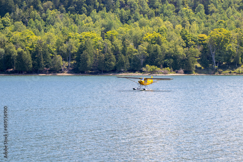 Fototapeta Naklejka Na Ścianę i Meble -  seaplane landing on a lake on a summer day in Gore Bay, Ontario