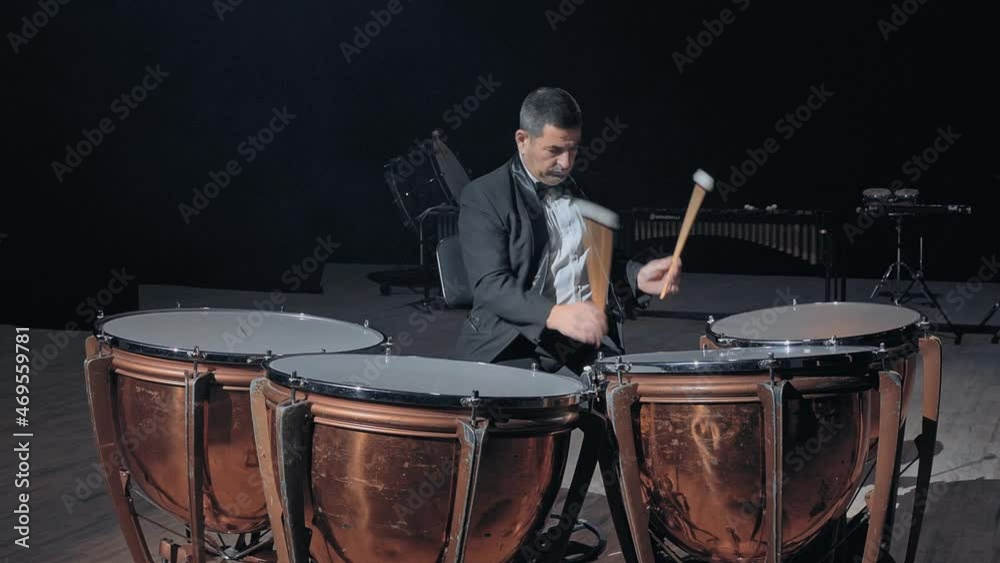 Musician playing the timpani