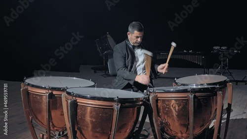 Musician playing the timpani photo