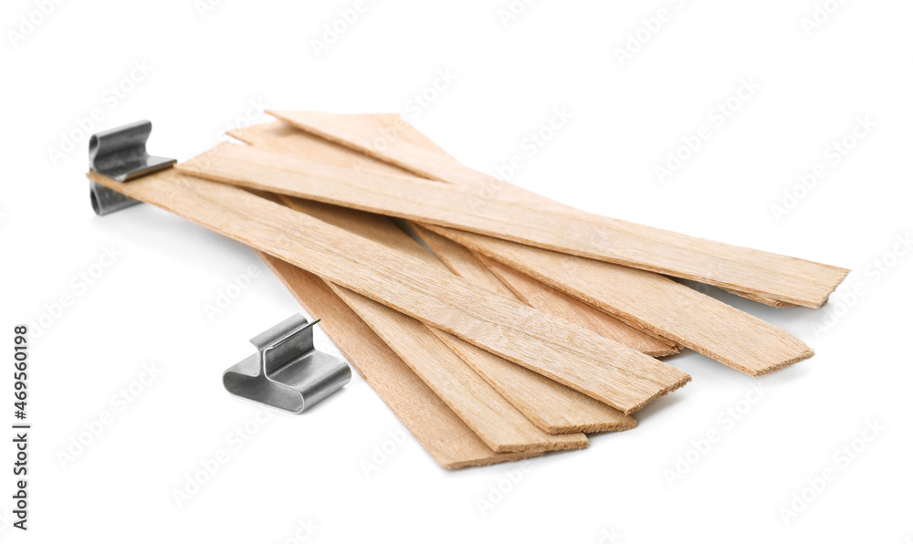 Wooden wicks with stabilizers on white background. Homemade candle material Wooden wicks with stabilizers on white background. Homemade candle material