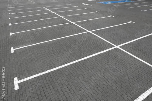 Empty car parking lots with white marking lines outdoors