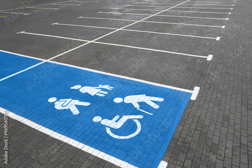Fototapeta Naklejka Na Ścianę i Meble -  Empty car parking lot with handicapped symbols outdoors