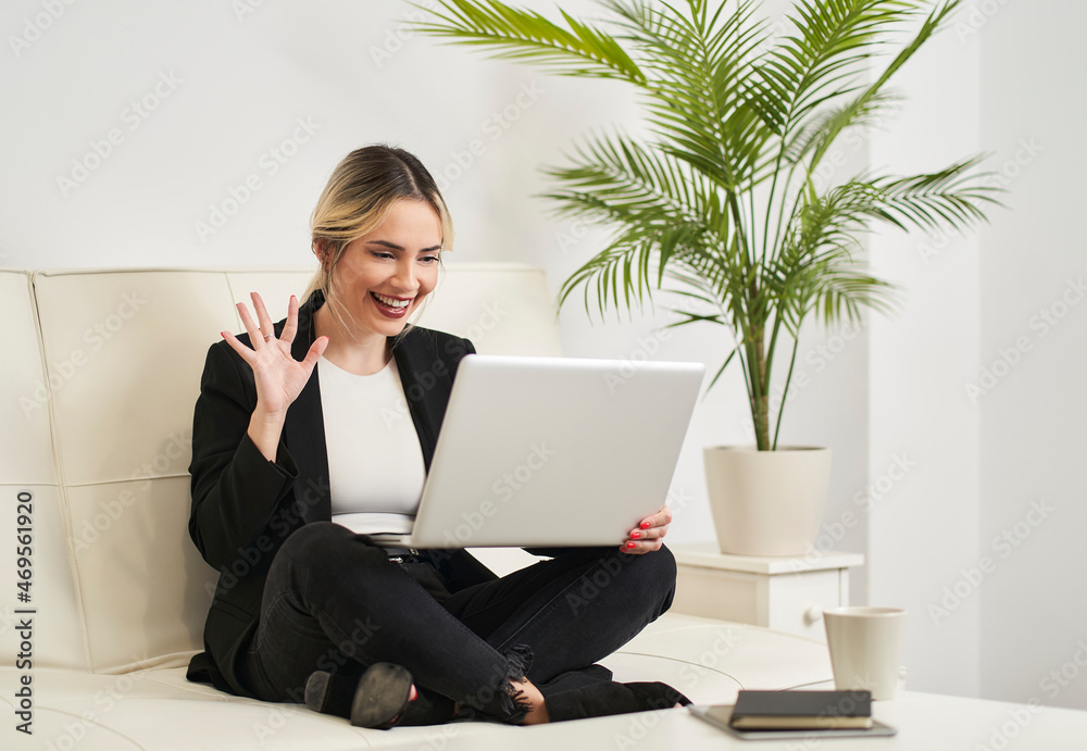 young woman talking on video call from laptop young woman talking on video call from laptop