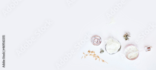 Dermatology cosmetics on white background. Trendy facecare cosmetics set. Alginate mask, serum droplet and patches. Natural forest moss and oat. Hyaluronic and moisturizing products. Extra wide banner