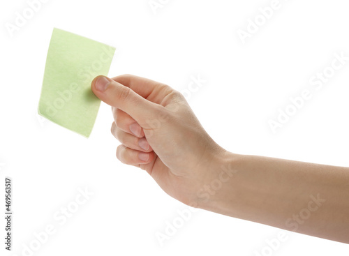 Man holding facial oil blotting tissue on white background, closeup. Mattifying wipe