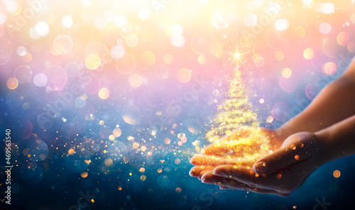 Magic Christmas Tree - Shiny Golden Light In Hands At Night