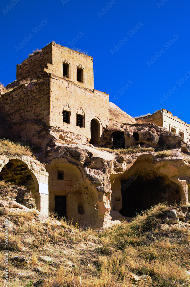 Close-up view of ruins of house in the cave. Picturesque landscape view of ancient cavetown near Goreme in Cappadocia. Popular travel destination in Turkey. UNESCO World Heritage Site