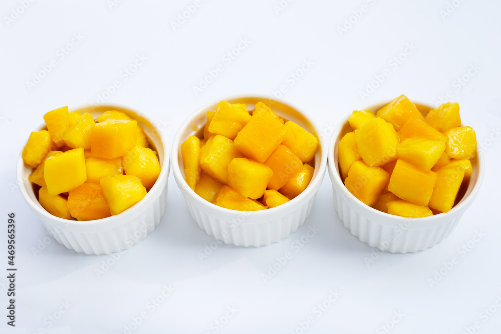 Tropical fruit, Mango cube slices in white cups on white background. Tropical fruit, Mango cube slices in white cups on white background.