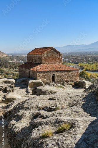 The Uplistsikhe cave complex near Gori, Georgia. Three-nave basilica on the rock. Ancient rock-hewn town in eastern Georgia. Georgian gourist landmark