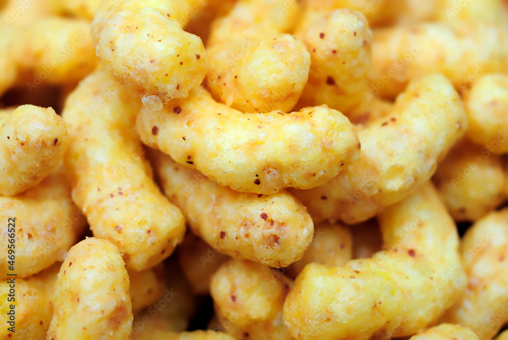 Puffed corn snacks with peanuts and cheese flavor Puffed corn snacks with peanuts and cheese flavor