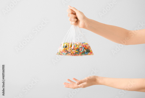 Female hands with pills in ...