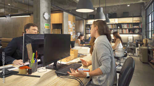 Wallpaper Mural A group of multi ethnic business team talk, communicate, discuss, and work in meeting room in office, present ideas with a computer technology device to colleagues. People lifestyle. Corporation Torontodigital.ca
