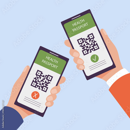 Two smartphones in hands with valid and invalid electronic Covid-19 health passport. Mobile app with QR code and vaccination certificate as proof of immunisation against coronavirus. photo
