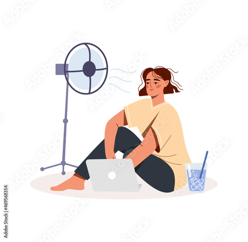 Work in hot weather. Young tired woman sitting on floor, drinking cooling beverage and escaping from heat with help of fan. Employee with laptop. High air temperature. Cartoon flat vector illustration